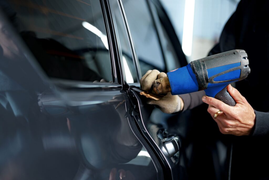 close up of male car service worker applying nano 2026 01 08 22 38 41 utc Windshield Repair